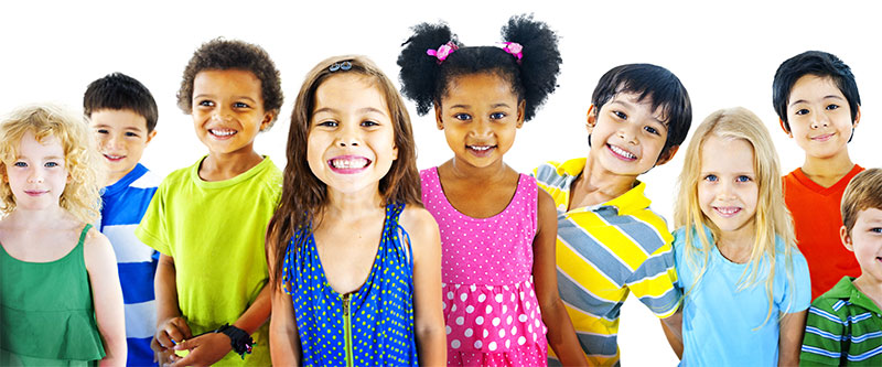 The image is a collage of individual headshots of seven children, each with varying expressions and colors of clothing, against a white background.